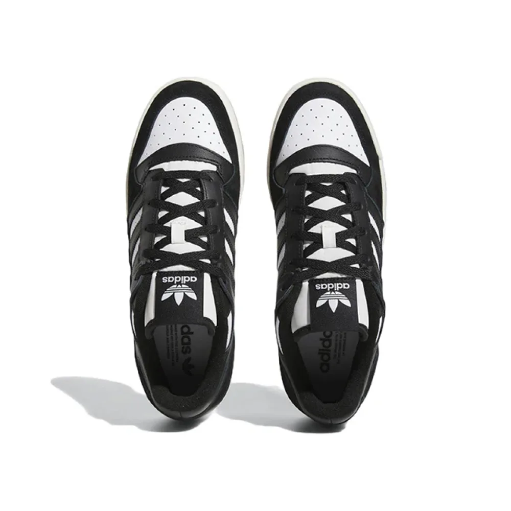 Чёрные Forum Low Cl с логотипом и белыми акцентами. Уникальный дизайн с кожаной отделкой для casual-стиля